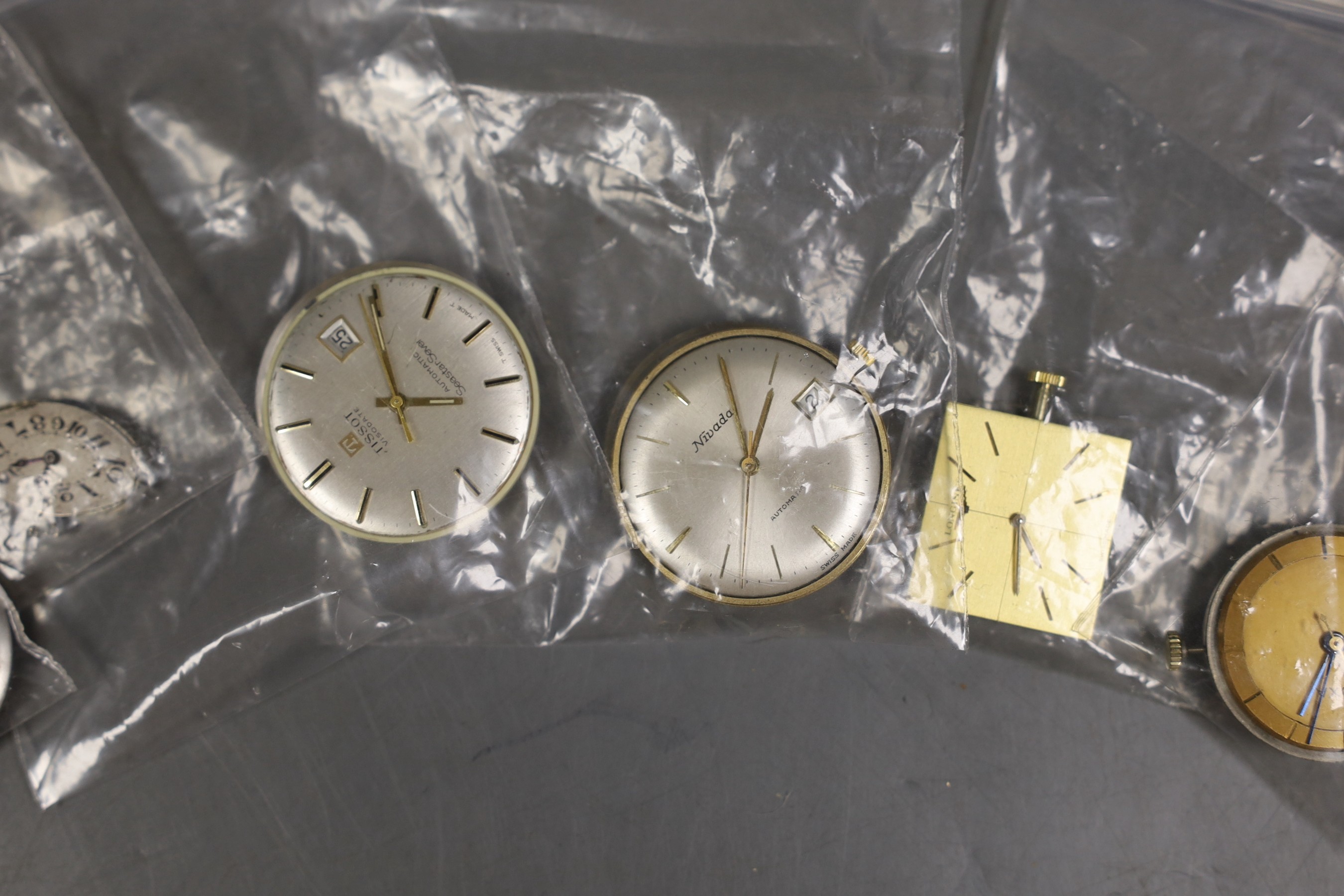 Six assorted wrist watch movements including Longines, Langton, Nivada, Tissot, Doxa and lady's oval dial.